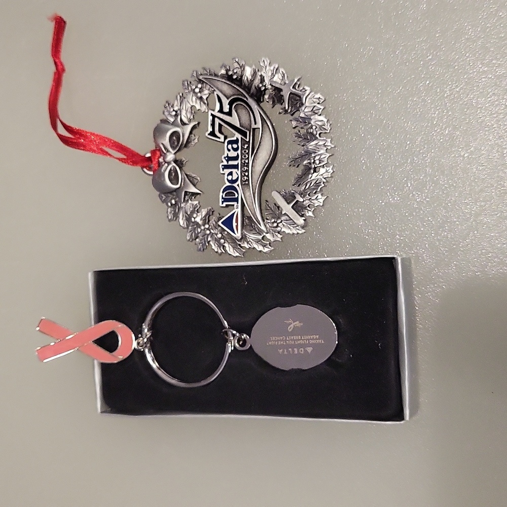 1 Delta keyring, 1- 75th year Christmas ornament.
